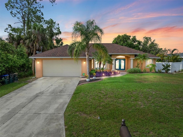 2373 Chartwell Ave, North Port, FL 34288 - view of front of house with a garage, concrete driveway, and stucco siding