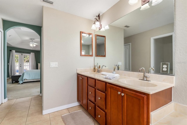2373 Chartwell Ave, North Port, FL 34288 - ensuite bathroom featuring double vanity, tile patterned flooring, and a ceiling fan