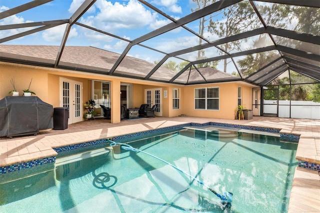 2373 Chartwell Ave, North Port, FL 34288 - swimming pool with french doors, a patio, grilling area, and glass enclosure