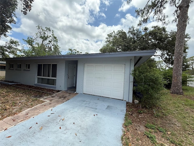 2174 Schwalbe Way, Sarasota, FL 34235 - ranch-style home featuring an attached garage and driveway