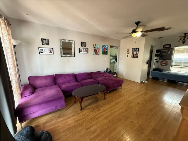 2174 Schwalbe Way, Sarasota, FL 34235 - living area featuring wood finished floors and a ceiling fan