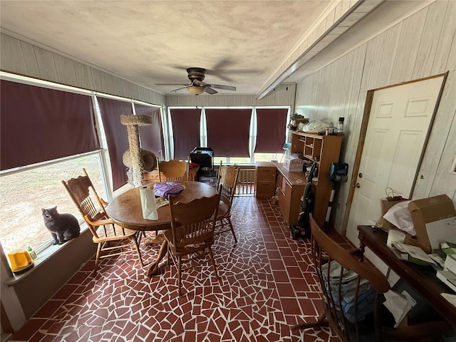 2174 Schwalbe Way, Sarasota, FL 34235 - dining space featuring a ceiling fan and wooden walls