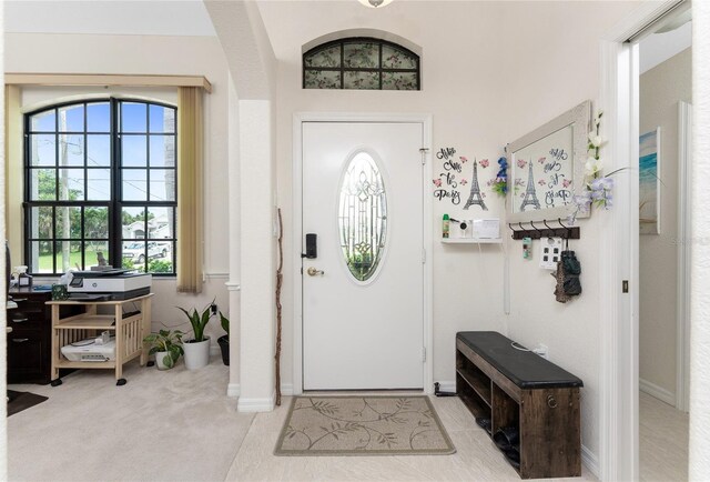 167 Marker Rd, Rotonda West, FL 33947 - entrance foyer with baseboards and arched walkways