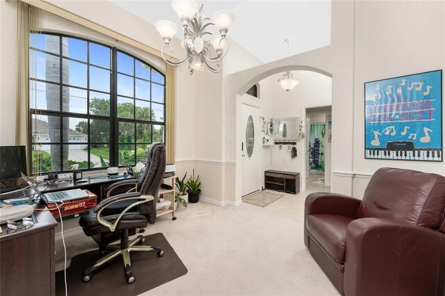 167 Marker Rd, Rotonda West, FL 33947 - carpeted office space featuring a chandelier and arched walkways
