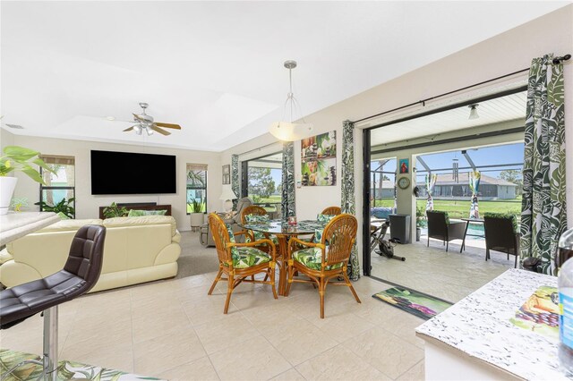 167 Marker Rd, Rotonda West, FL 33947 - dining space with plenty of natural light, a ceiling fan, and a raised ceiling