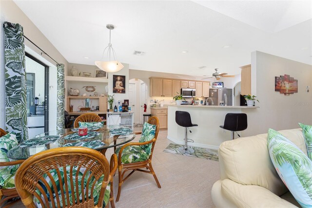 167 Marker Rd, Rotonda West, FL 33947 - dining area with ceiling fan, arched walkways, and recessed lighting