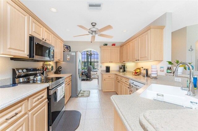 167 Marker Rd, Rotonda West, FL 33947 - kitchen featuring stainless steel appliances, light brown cabinets, light countertops, ceiling fan, and recessed lighting