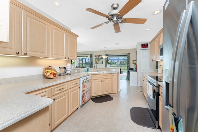 167 Marker Rd, Rotonda West, FL 33947 - kitchen featuring stainless steel fridge, electric stove, dishwasher, light brown cabinets, and a peninsula