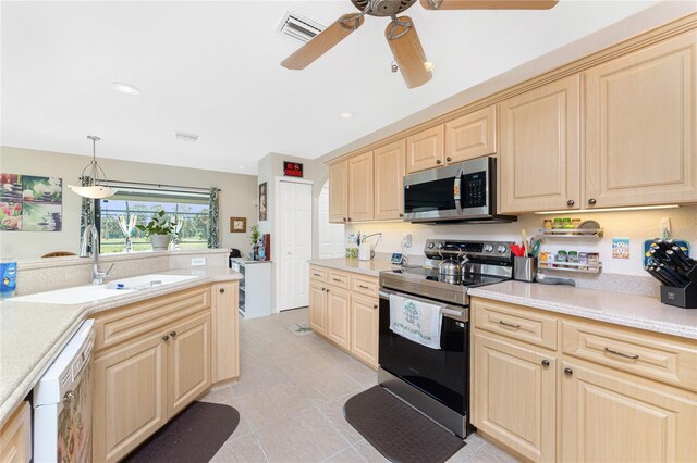 167 Marker Rd, Rotonda West, FL 33947 - kitchen featuring appliances with stainless steel finishes, light countertops, a ceiling fan, light brown cabinetry, and recessed lighting