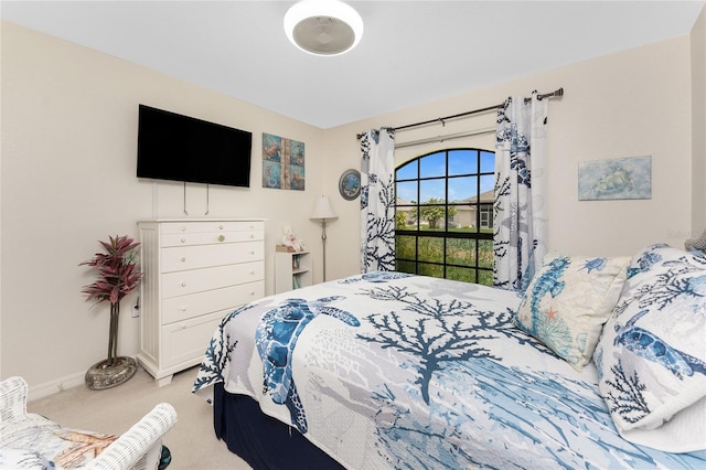 167 Marker Rd, Rotonda West, FL 33947 - bedroom with light carpet and baseboards