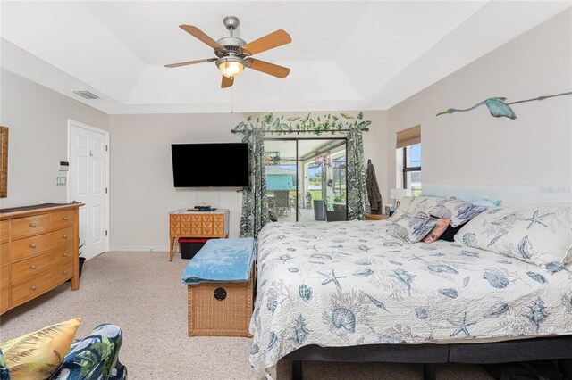 167 Marker Rd, Rotonda West, FL 33947 - bedroom with a raised ceiling, access to outside, carpet, and a ceiling fan