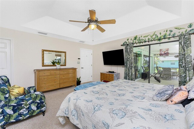 167 Marker Rd, Rotonda West, FL 33947 - bedroom with carpet flooring, a raised ceiling, and ceiling fan