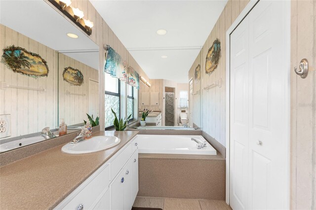 167 Marker Rd, Rotonda West, FL 33947 - bathroom featuring a closet, vanity, a bath, and recessed lighting