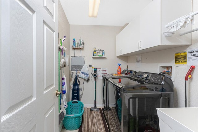 167 Marker Rd, Rotonda West, FL 33947 - washroom featuring separate washer and dryer and cabinet space
