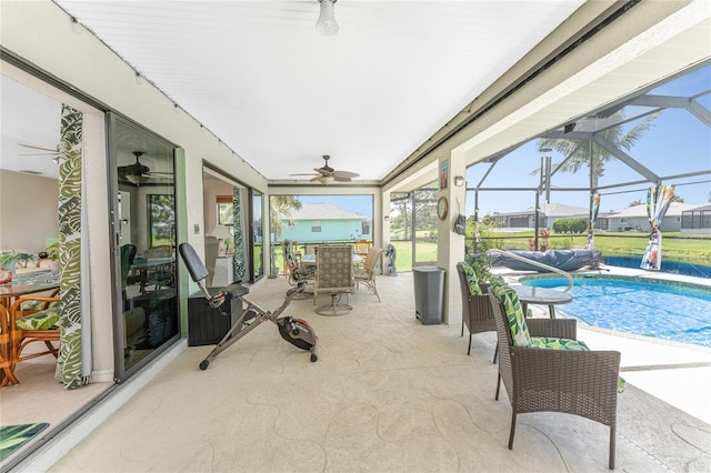 167 Marker Rd, Rotonda West, FL 33947 - view of patio / terrace with ceiling fan, outdoor dining space, an outdoor pool, and glass enclosure