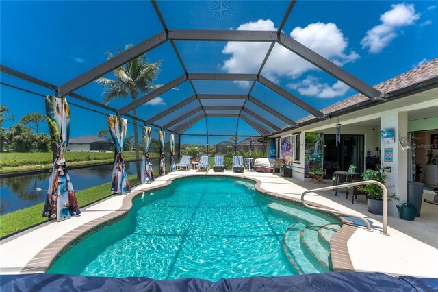 167 Marker Rd, Rotonda West, FL 33947 - outdoor pool featuring a patio, a water view, and glass enclosure