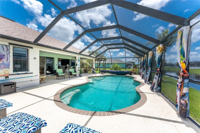 167 Marker Rd, Rotonda West, FL 33947 - outdoor pool featuring a patio and glass enclosure