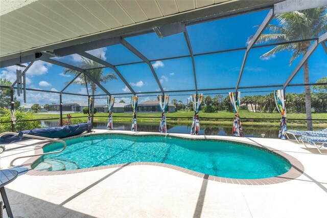 167 Marker Rd, Rotonda West, FL 33947 - swimming pool featuring a patio, glass enclosure, and a water view