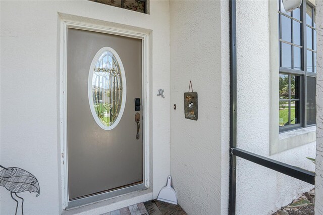 167 Marker Rd, Rotonda West, FL 33947 - entrance to property with stucco siding