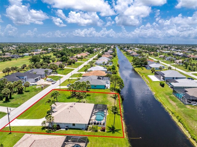 167 Marker Rd, Rotonda West, FL 33947 - aerial perspective of suburban area featuring property parcel outlined and a nearby body of water
