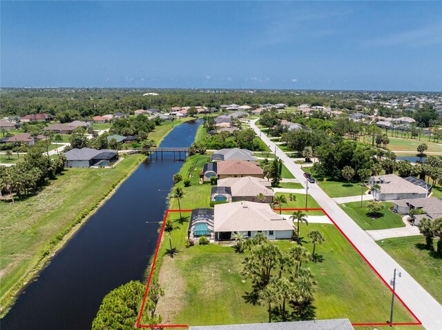 167 Marker Rd, Rotonda West, FL 33947 - aerial view of residential area with a large body of water and property boundaries highlighted