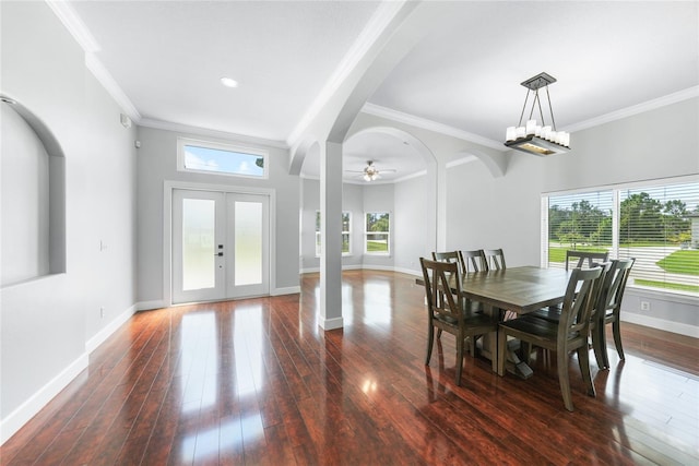1523 Napoleon Rd, North Port, FL 34288 - dining space with healthy amount of natural light, hardwood / wood-style floors, french doors, crown molding, and a ceiling fan