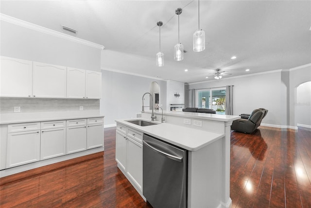 1523 Napoleon Rd, North Port, FL 34288 - kitchen featuring dishwasher, arched walkways, ornamental molding, open floor plan, and light countertops