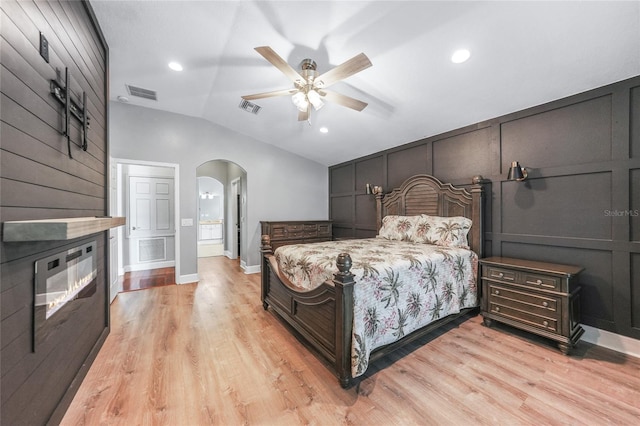 1523 Napoleon Rd, North Port, FL 34288 - bedroom with lofted ceiling, arched walkways, light wood-style floors, recessed lighting, and ceiling fan