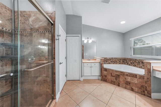 1523 Napoleon Rd, North Port, FL 34288 - full bathroom with vanity, a bath, a stall shower, and tile patterned flooring