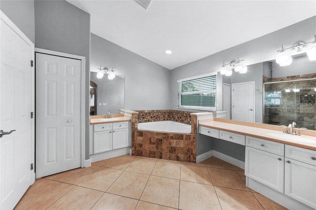 1523 Napoleon Rd, North Port, FL 34288 - full bath featuring vaulted ceiling, tile patterned floors, a stall shower, two vanities, and a bath