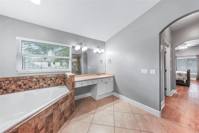 1523 Napoleon Rd, North Port, FL 34288 - bathroom with vanity, a bath, connected bathroom, tile patterned floors, and tiled shower