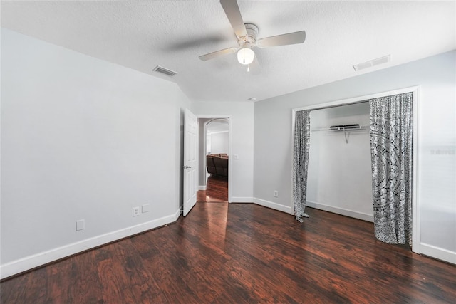 1523 Napoleon Rd, North Port, FL 34288 - unfurnished bedroom with wood finished floors, a textured ceiling, a closet, and ceiling fan