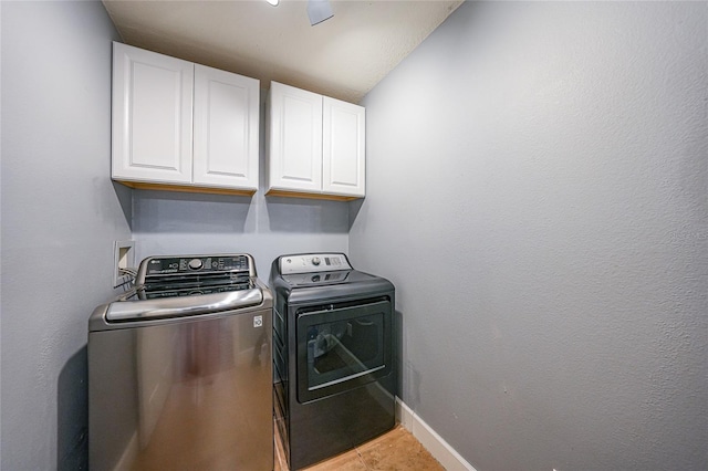 1523 Napoleon Rd, North Port, FL 34288 - laundry area with cabinet space, washing machine and dryer, and tile patterned floors