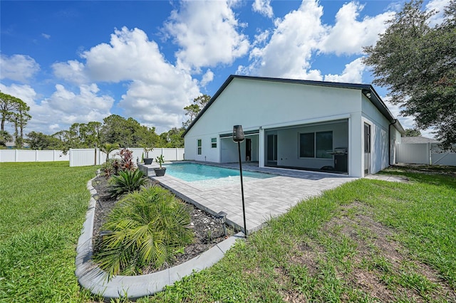 1523 Napoleon Rd, North Port, FL 34288 - back of house featuring a fenced backyard, a patio area, and stucco siding