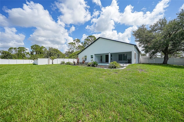 1523 Napoleon Rd, North Port, FL 34288 - rear view of house featuring a fenced backyard and stucco siding
