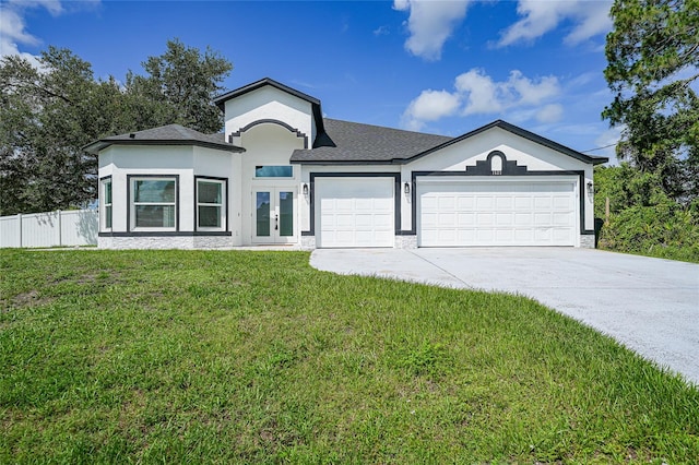 1523 Napoleon Rd, North Port, FL 34288 - ranch-style home with french doors, an attached garage, driveway, stucco siding, and a shingled roof