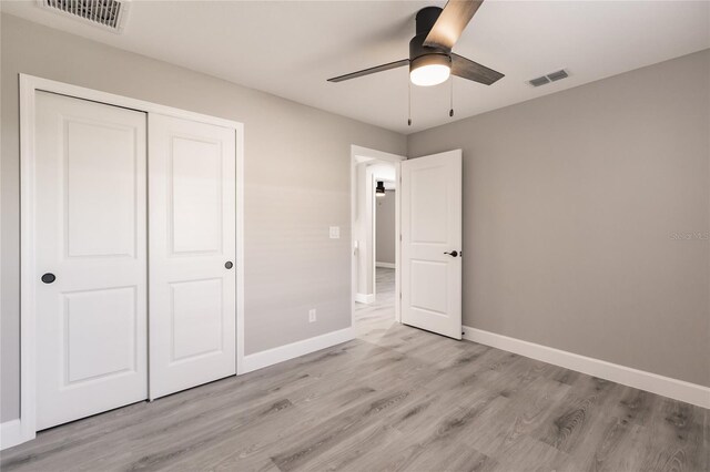 16403 Perdida Ct, Punta Gorda, FL 33955 - unfurnished bedroom featuring light wood-style floors, a closet, and ceiling fan