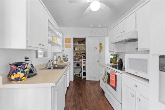 3197 Normandy Dr, Port Charlotte, FL 33952 - kitchen featuring under cabinet range hood, white appliances, light countertops, ceiling fan, and white cabinetry