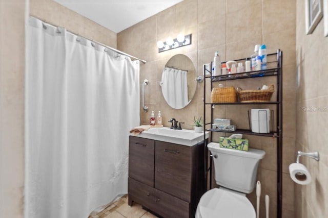 3197 Normandy Dr, Port Charlotte, FL 33952 - bathroom featuring tile walls, vanity, a shower with shower curtain, and tile patterned flooring