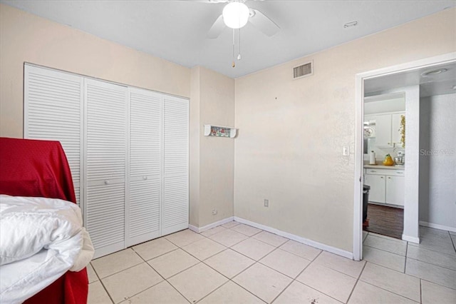 3197 Normandy Dr, Port Charlotte, FL 33952 - bedroom with light tile patterned flooring, a closet, and ceiling fan
