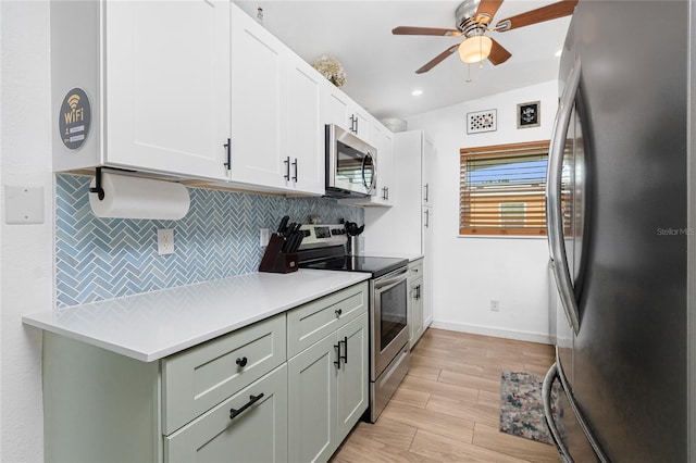 720 Dalton Blvd, Port Charlotte, FL 33952 - kitchen featuring appliances with stainless steel finishes, decorative backsplash, ceiling fan, light countertops, and light wood-style floors