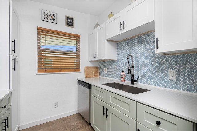 720 Dalton Blvd, Port Charlotte, FL 33952 - kitchen featuring dishwasher, backsplash, light countertops, and wood finished floors
