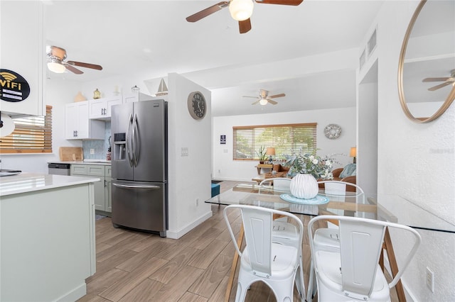 720 Dalton Blvd, Port Charlotte, FL 33952 - kitchen featuring stainless steel appliances, ceiling fan, plenty of natural light, and light wood finished floors