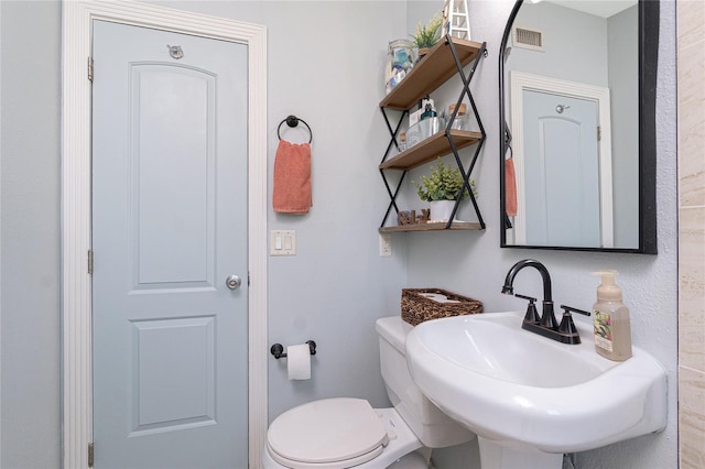 720 Dalton Blvd, Port Charlotte, FL 33952 - half bathroom with a sink and toilet