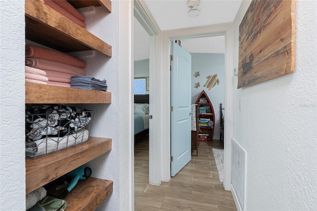 720 Dalton Blvd, Port Charlotte, FL 33952 - hall featuring a textured wall and wood finished floors