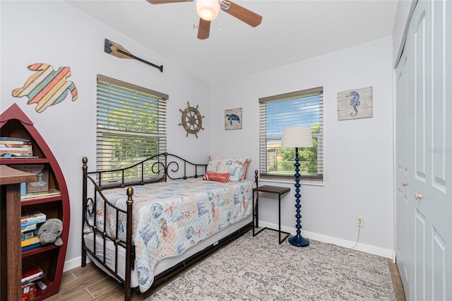 720 Dalton Blvd, Port Charlotte, FL 33952 - bedroom featuring multiple windows, a closet, a ceiling fan, and wood finished floors