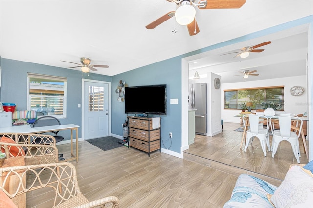 720 Dalton Blvd, Port Charlotte, FL 33952 - living room featuring a ceiling fan and light wood-style floors