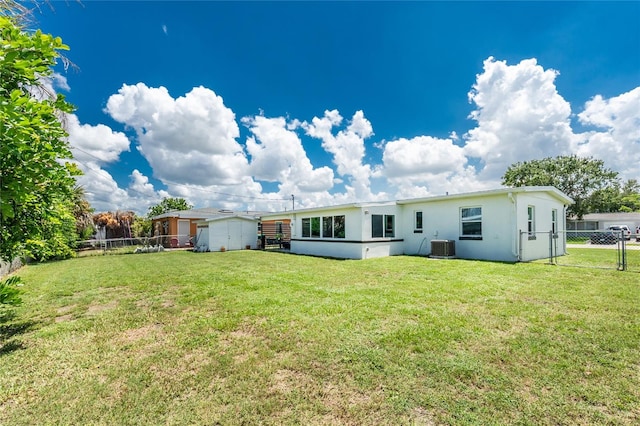 720 Dalton Blvd, Port Charlotte, FL 33952 - back of house with stucco siding, a storage unit, a fenced backyard, and a gate