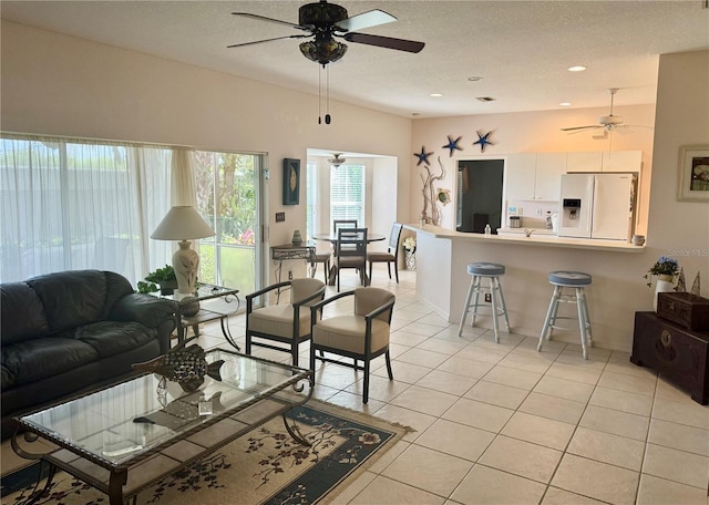 1625 Red Oak Ln, Port Charlotte, FL 33948 - living area with a ceiling fan, a textured ceiling, and light tile patterned floors
