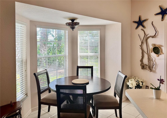 1625 Red Oak Ln, Port Charlotte, FL 33948 - dining space featuring a textured wall and light tile patterned floors
